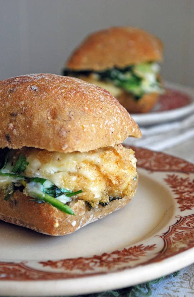 Cheesy Spinach Baked Egg Sandwiches - So cheesy, full of garlic, spinach, and perfectly cooked eggs! Full recipe at theliveinkitchen.com